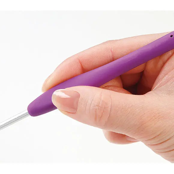 Purple Clover Amour crochet hook held with a relaxed fingertip grip