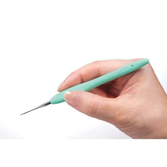 Clover Amour Steel crochet hook held comfortably in the fingertips
