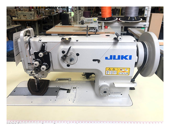 Juki LU-1508NH heavy-duty walking foot sewing machine, front view on sewing table