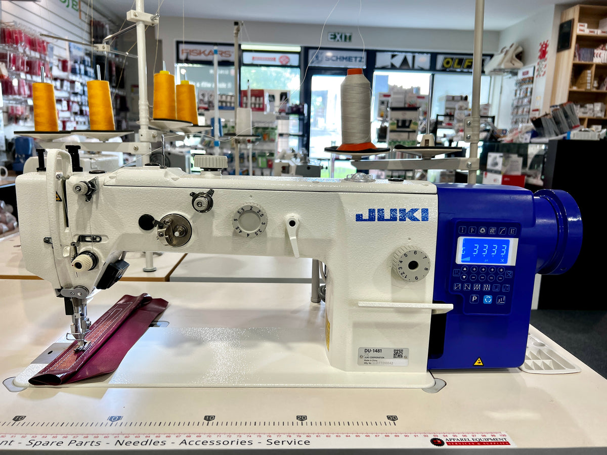 Juki DU-1481-7 automatic walking foot sewing machine, front view with stitched fabric sample