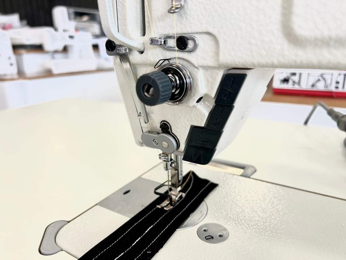 Close view of the Zoje A7100 controls beside the sewing area