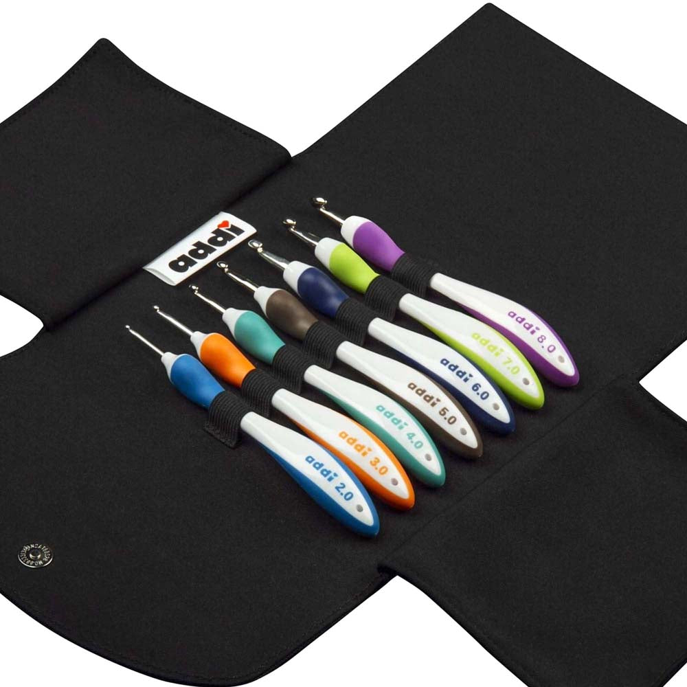 addiSwing ergonomic crochet hook set with seven colour-coded hooks and textile storage case