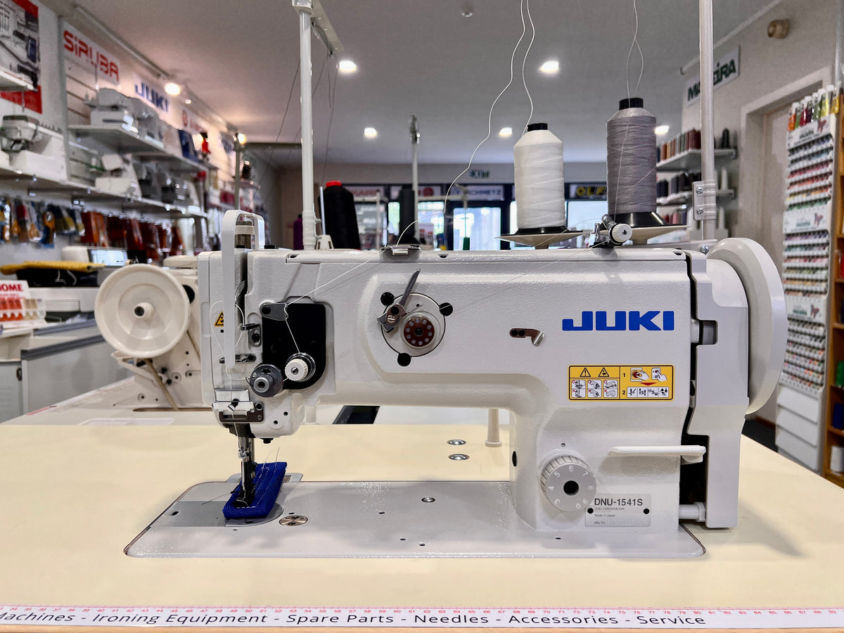 Juki 1541-series side-loading walking foot sewing machine, front view on sewing table