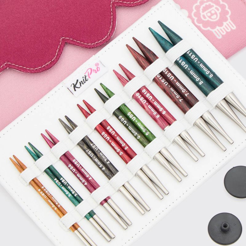 Close view of nine KnitPro Dreamz 10cm short interchangeable birchwood needle pairs arranged by size