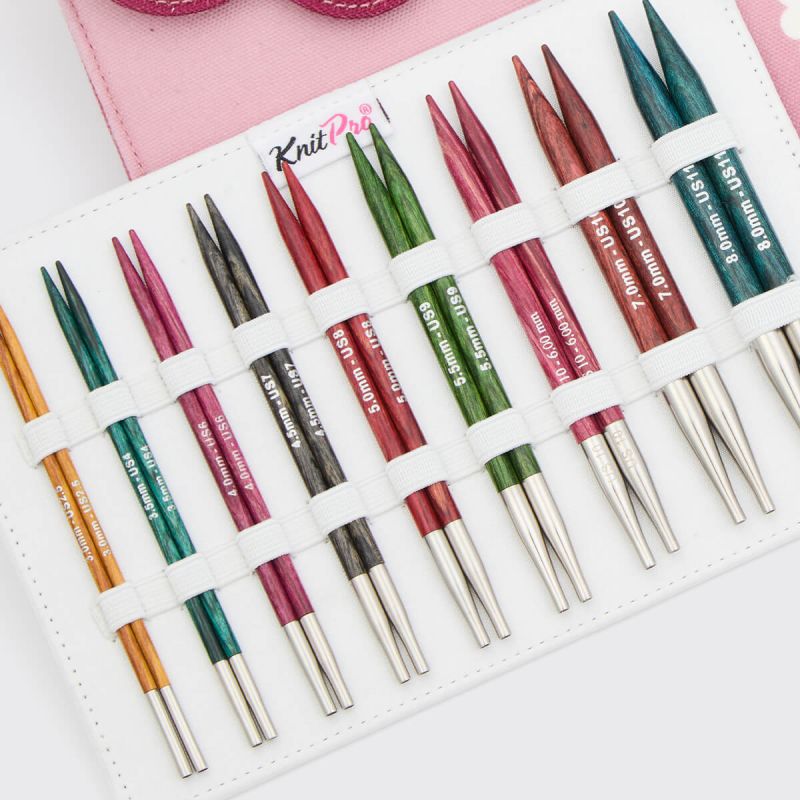 Close view of nine colour-coded KnitPro Dreamz 13cm interchangeable birchwood needle pairs