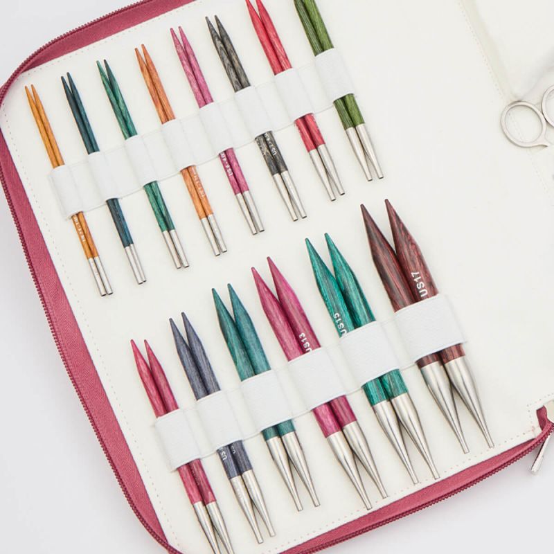 Close view of 14 colour-coded KnitPro Dreamz Grande birchwood interchangeable needle pairs