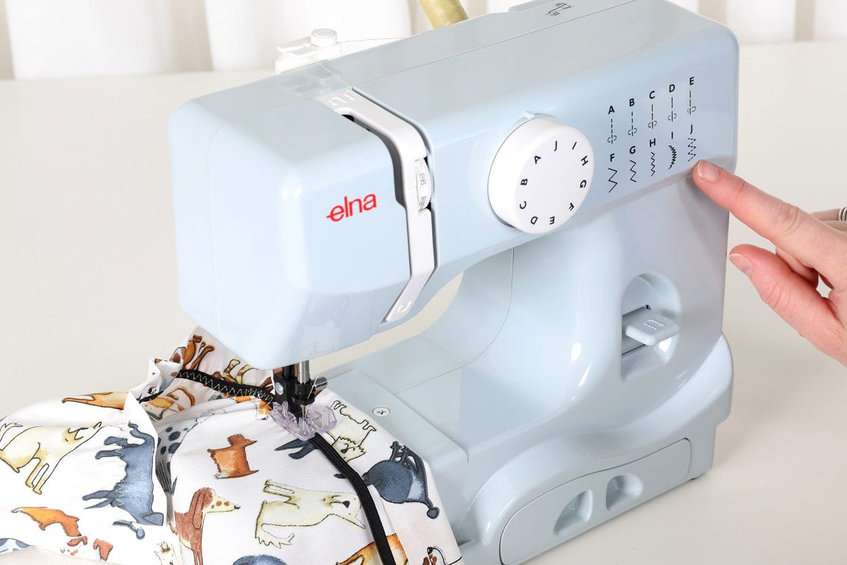 Elna 525 Mini sewing machine in grey, stitch selection guide