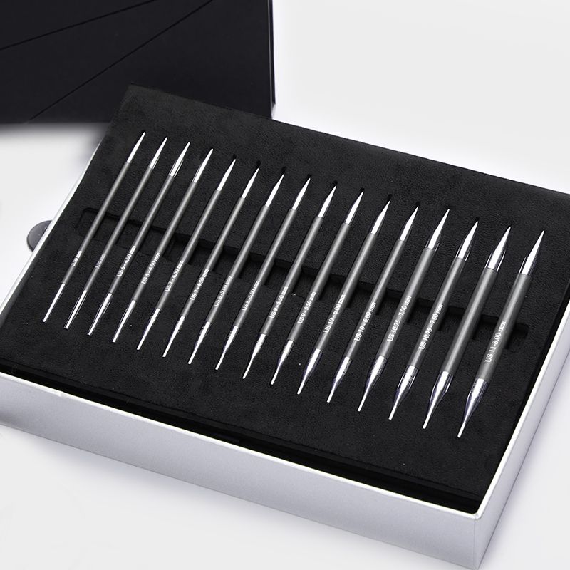 Eight pairs of KnitPro Karbonz 13cm carbon fibre interchangeable tips displayed in the Box of Joy