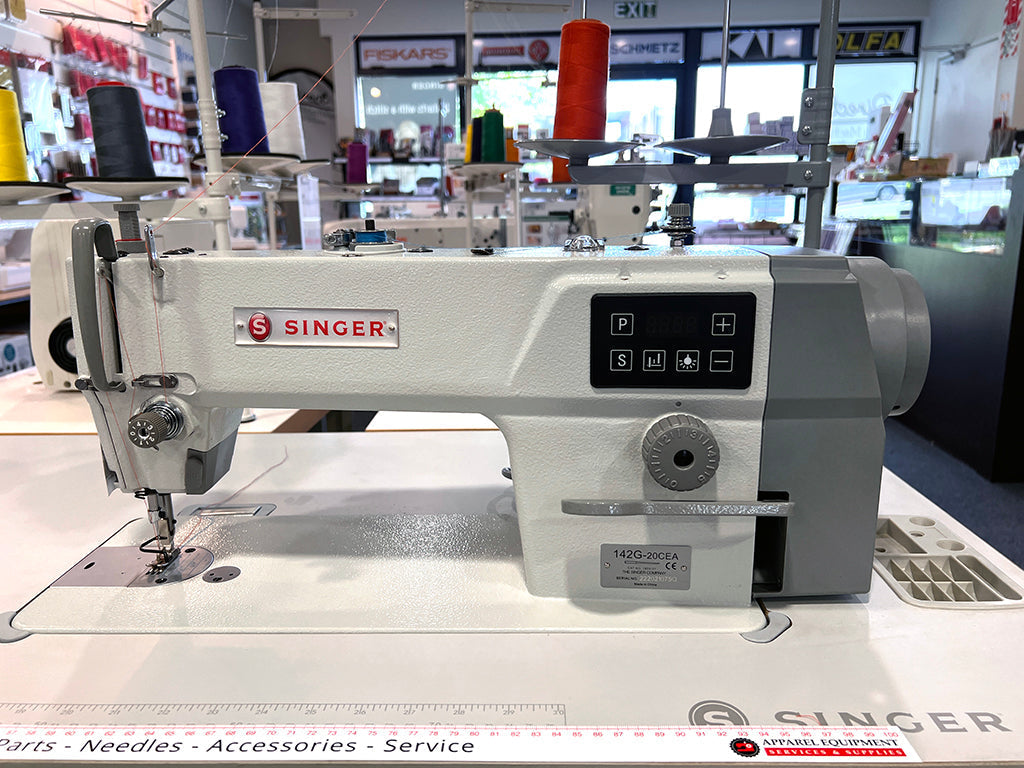 Singer 142G-30CEA industrial plain sewing machine on its table