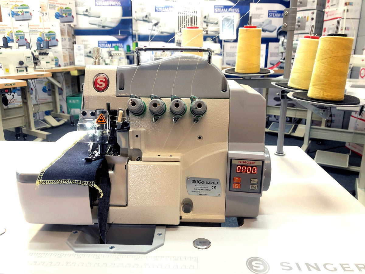 Singer 351G-241M four-thread industrial overlocker with thread stand and fabric sample
