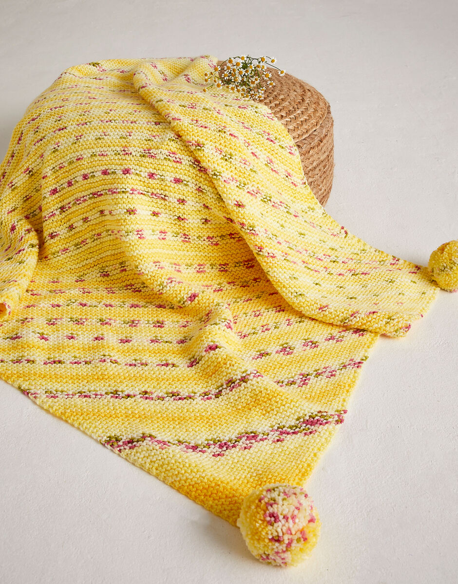 Sirdar Hayfield Petal Pom Pom Blanket Knitting Pattern 5575 – Baby Blossom Chunky Baby Blanket Pattern, finished design example