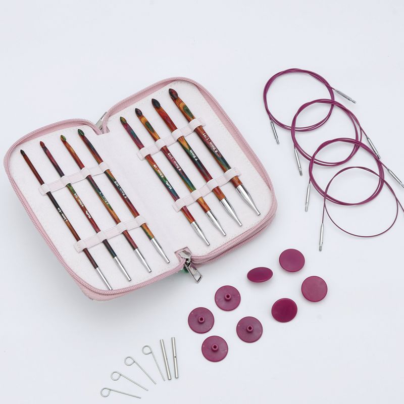 Complete KnitPro Symfonie 2 Tunisian crochet set with eight wooden hooks, four purple swivel cables, end caps, keys and printed case
