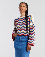 Wool and the Gang Malibu Sweater crochet pattern, angled model view showing the sleeves and neckline
